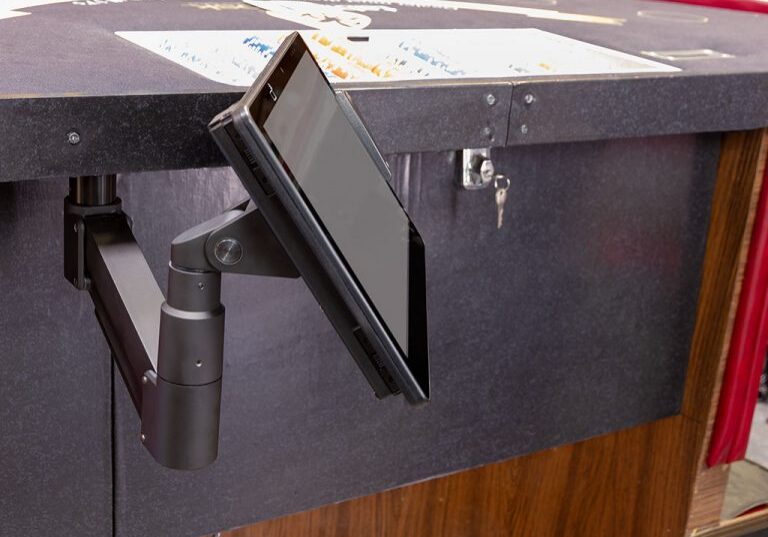 Adjustable tablet arm on gaming table